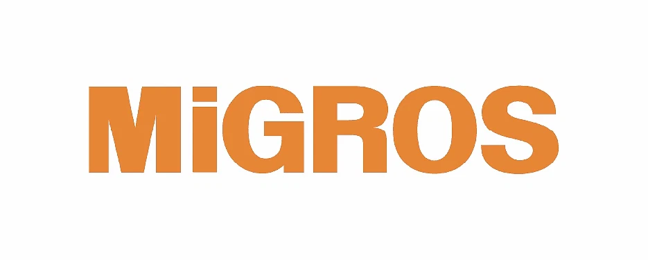 Migros kasiyer maaşları ve çalışma şartları Migros'un logo tasarımı, perakende sektöründe tanınan bir markayı simgeliyor.